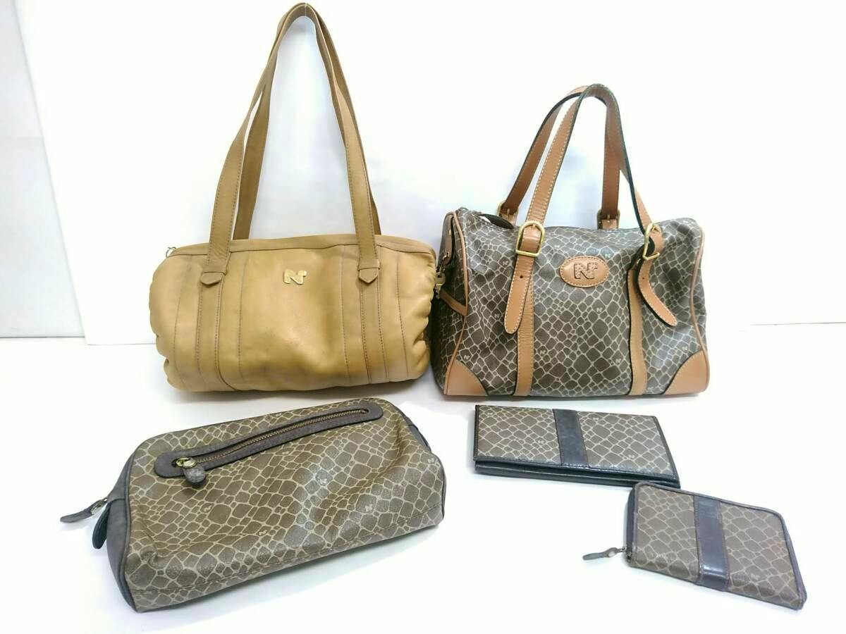 Five-piece NINA RICCI set on a white background showing two handbags (one tan leather, one giraffe-patterned) and three matching small accessories.