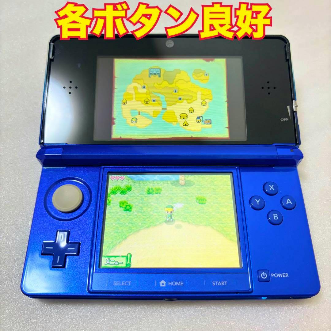 Blue Nintendo 3DS handheld console opened and powered on, showing game screens and visible buttons and circle pad.