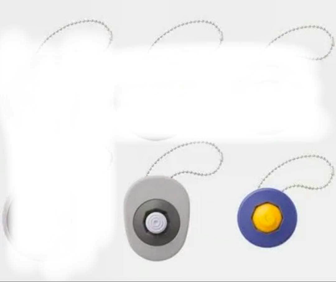 Two acrylic keychain joystick-style pieces, one gray and one blue with a yellow center, shown on a white background.