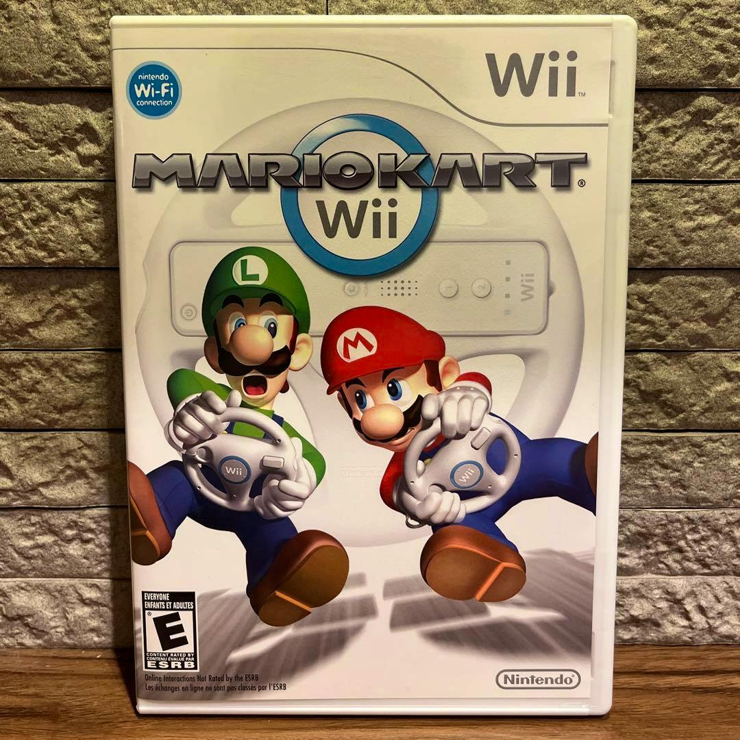 Front of the Mario Kart Wii (North American) game case showing cover art of Mario and Luigi holding Wii Wheels.