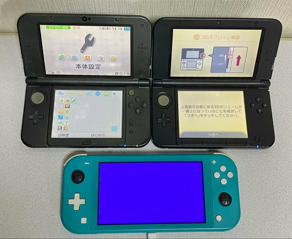 Three handheld Nintendo consoles arranged on a surface: two black clamshell 3DS/New3DS units with their screens open and a turquoise Nintendo Switch Lite with a bright blue screen.