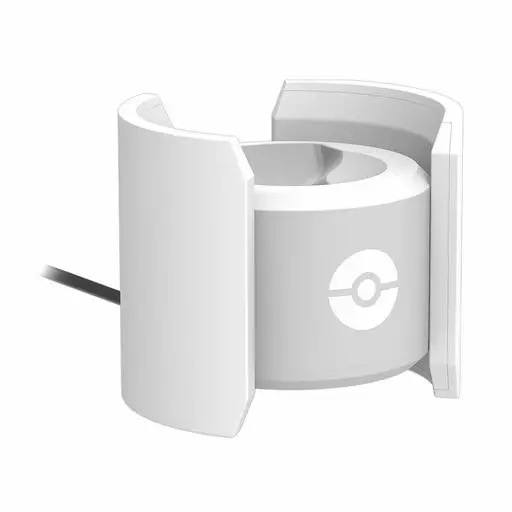 White charging stand for Monster Ball PLUS with a ball emblem and attached cable.
