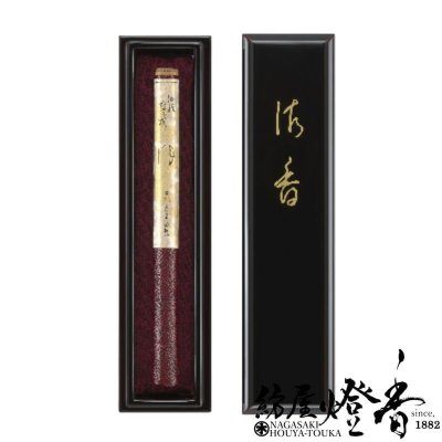 Black lacquered presentation box for Japanese incense shown closed (right) and open (left) to reveal a bundle of long incense sticks on red lining.