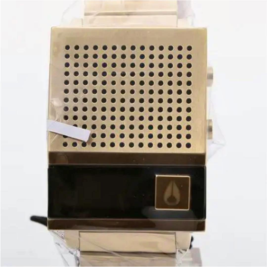Front view of a rose gold Nixon Dork Too watch showing a square perforated face and a black lower panel with the Nixon logo.