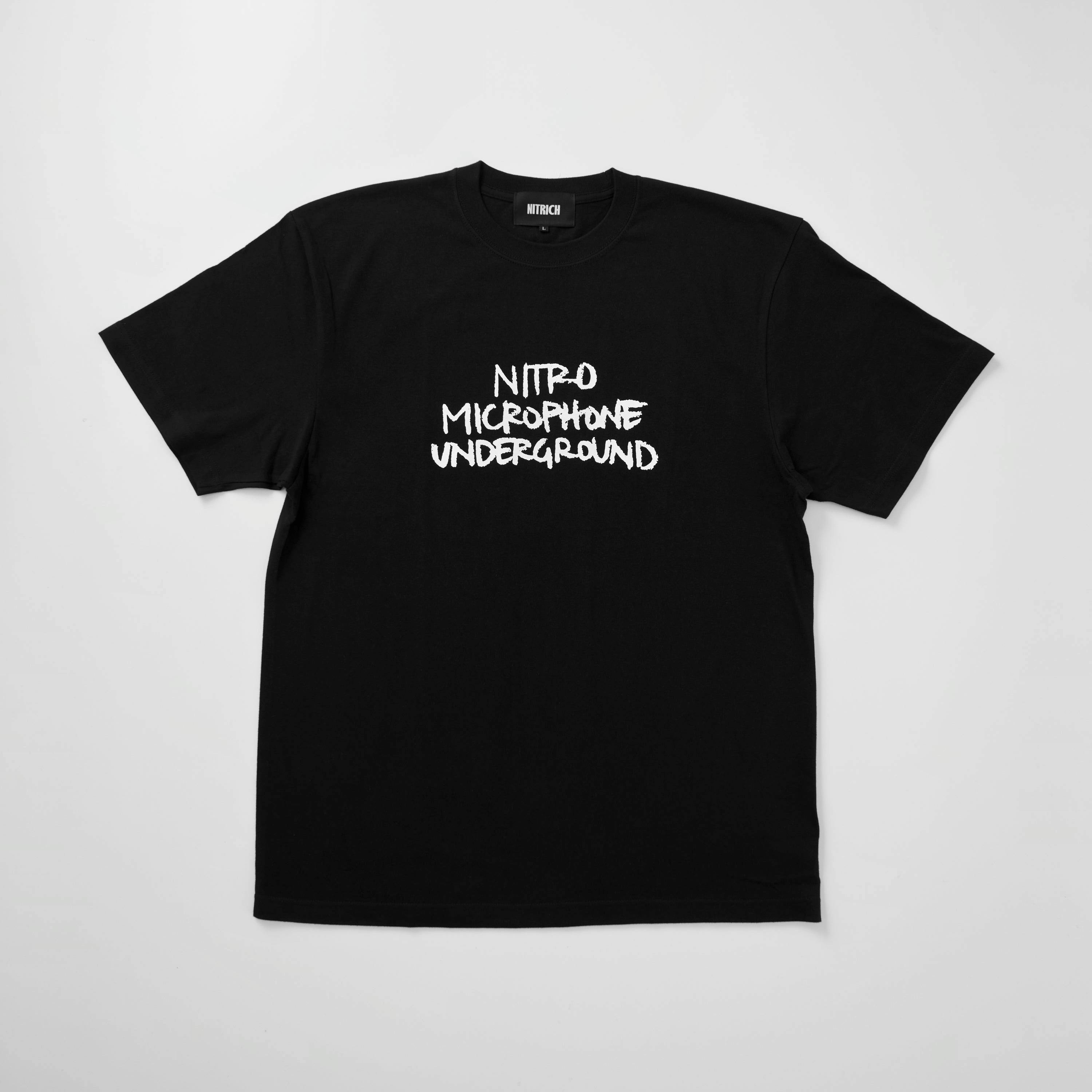 Black cotton T-shirt laid flat showing the upper front with white printed text and a visible neck label.