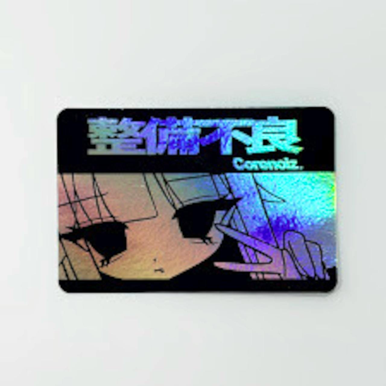 Holographic rectangular sticker showing Japanese characters and an anime-style face.