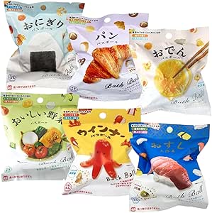 Six individually packaged bath balls from the Nol Corporation Realistic Foods assortment, each package showing a different food-themed mascot design.