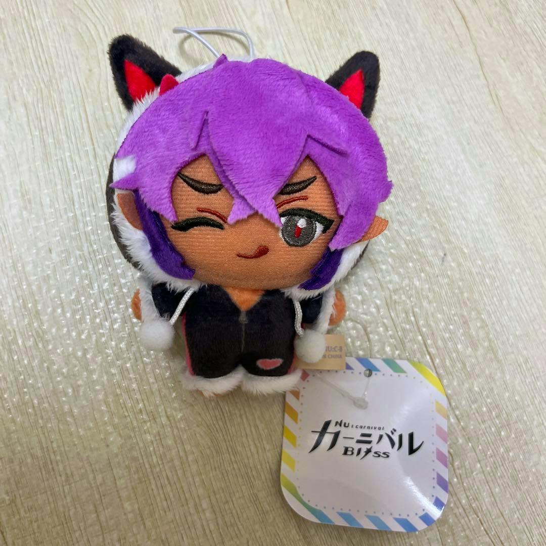 Plush mascot of NU:カーニバル Bliss (Morphis) with purple hair and attached product tag visible.