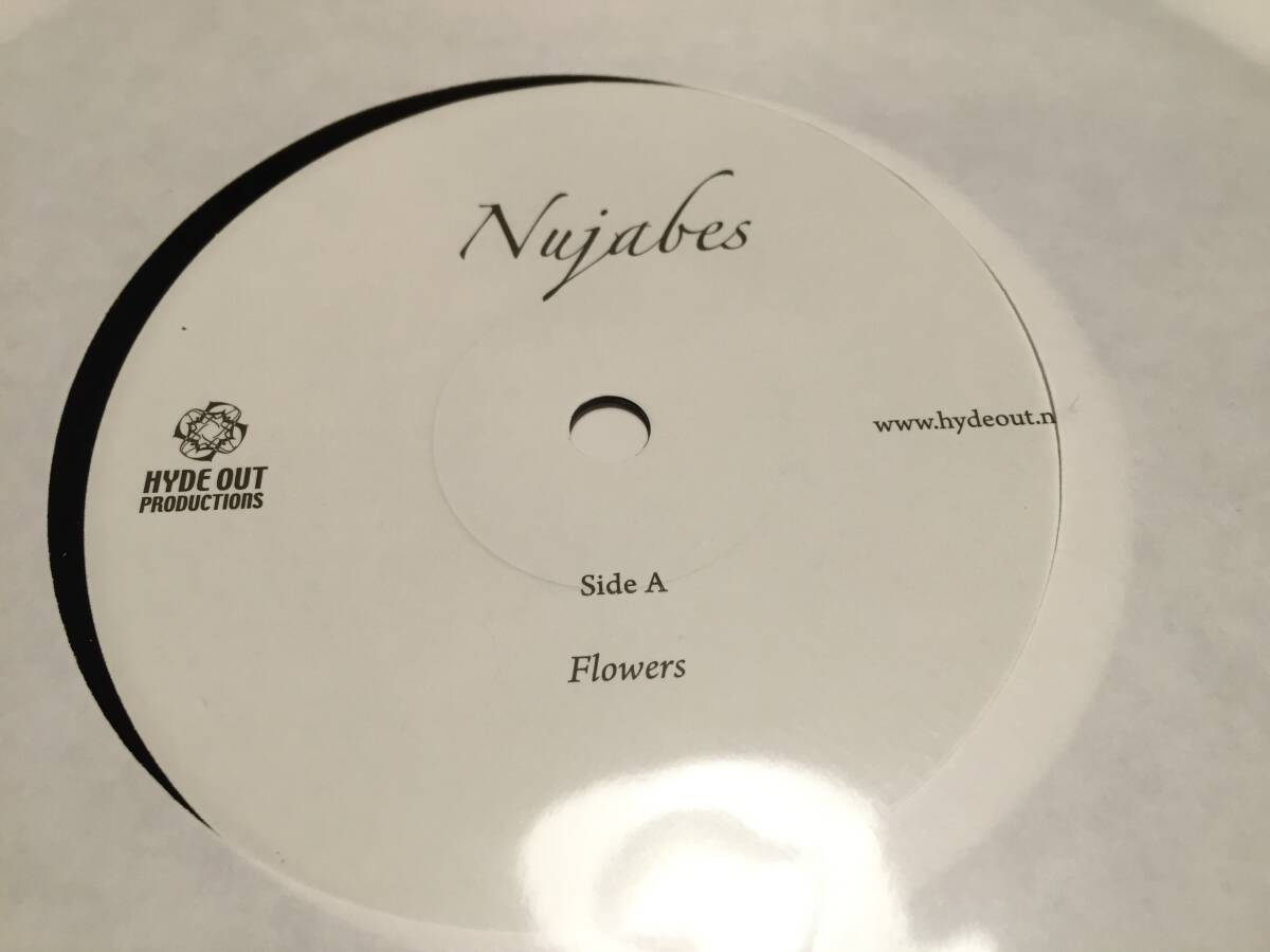Close-up photo of the vinyl record label reading “Nujabes” and “Side A Flowers.”