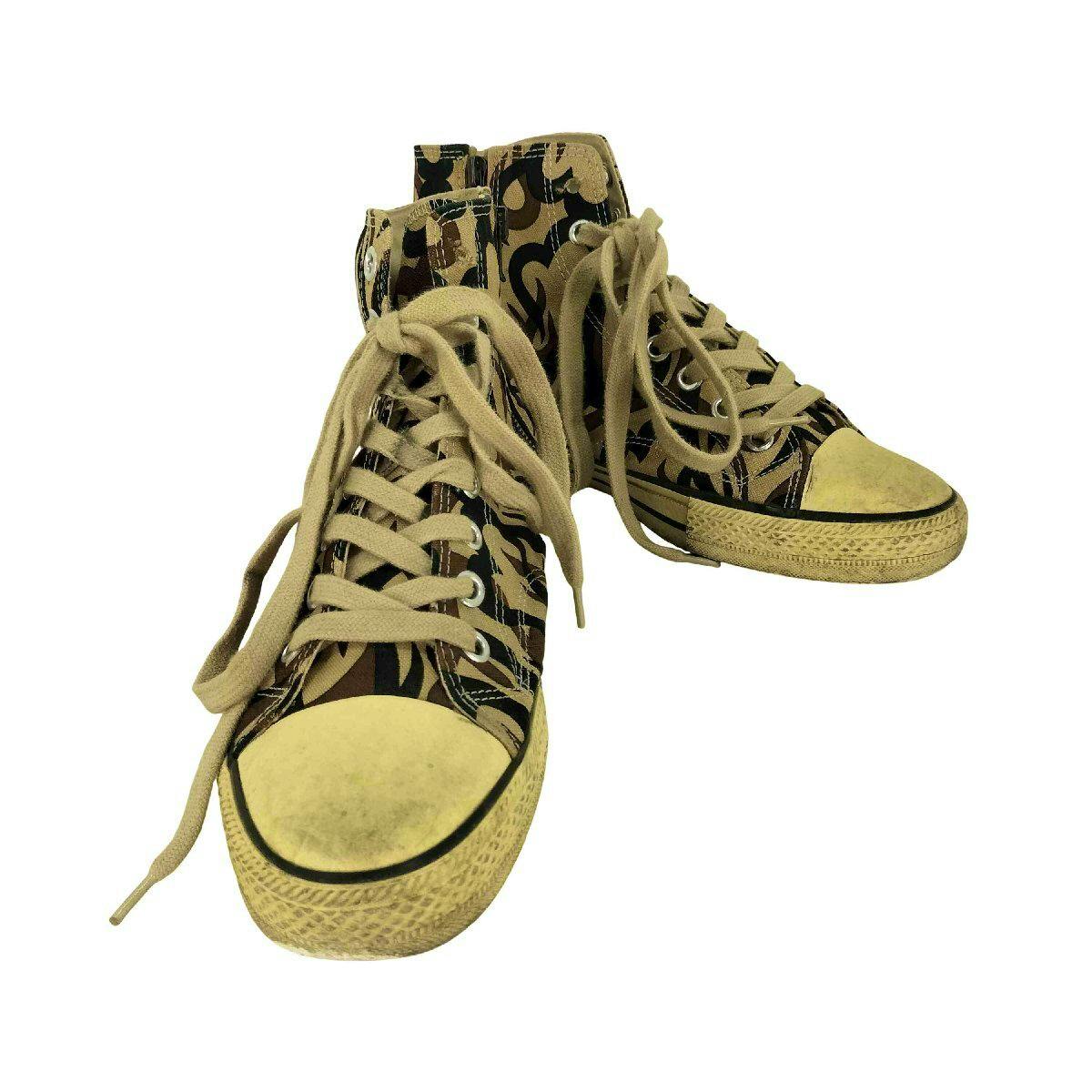 Front view of a pair of NUMBER(N)INE canvas high-top sneakers with beige laces and patterned canvas on a white background.