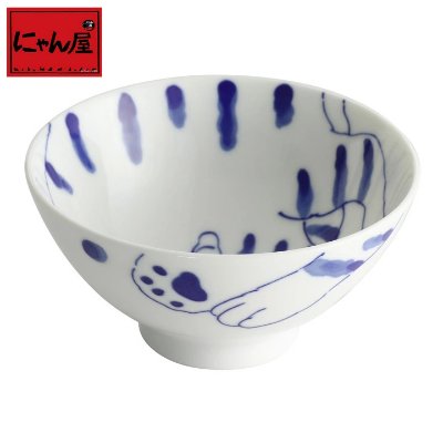Ceramic rice bowl with a blue painted cat motif visible on the inside and exterior.