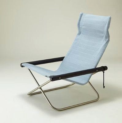Light blue-gray replacement seat mounted on a metal-frame folding chair photographed from a three-quarter angle.