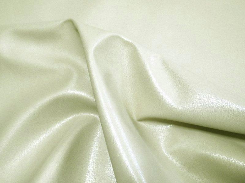 Off-white stretch faux leather polyester fabric draped to show texture and sheen.