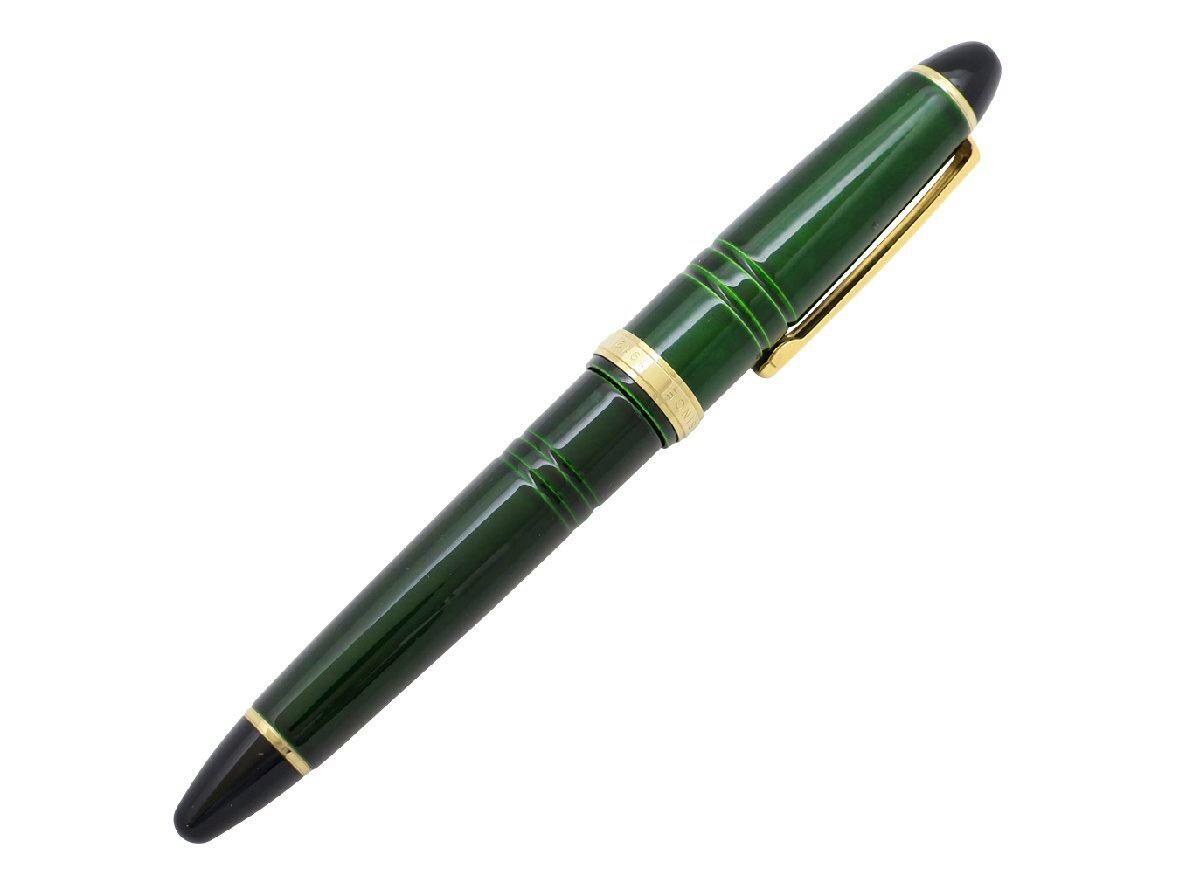 Green lacquer 14K fountain pen with gold trim shown capped on a white background.