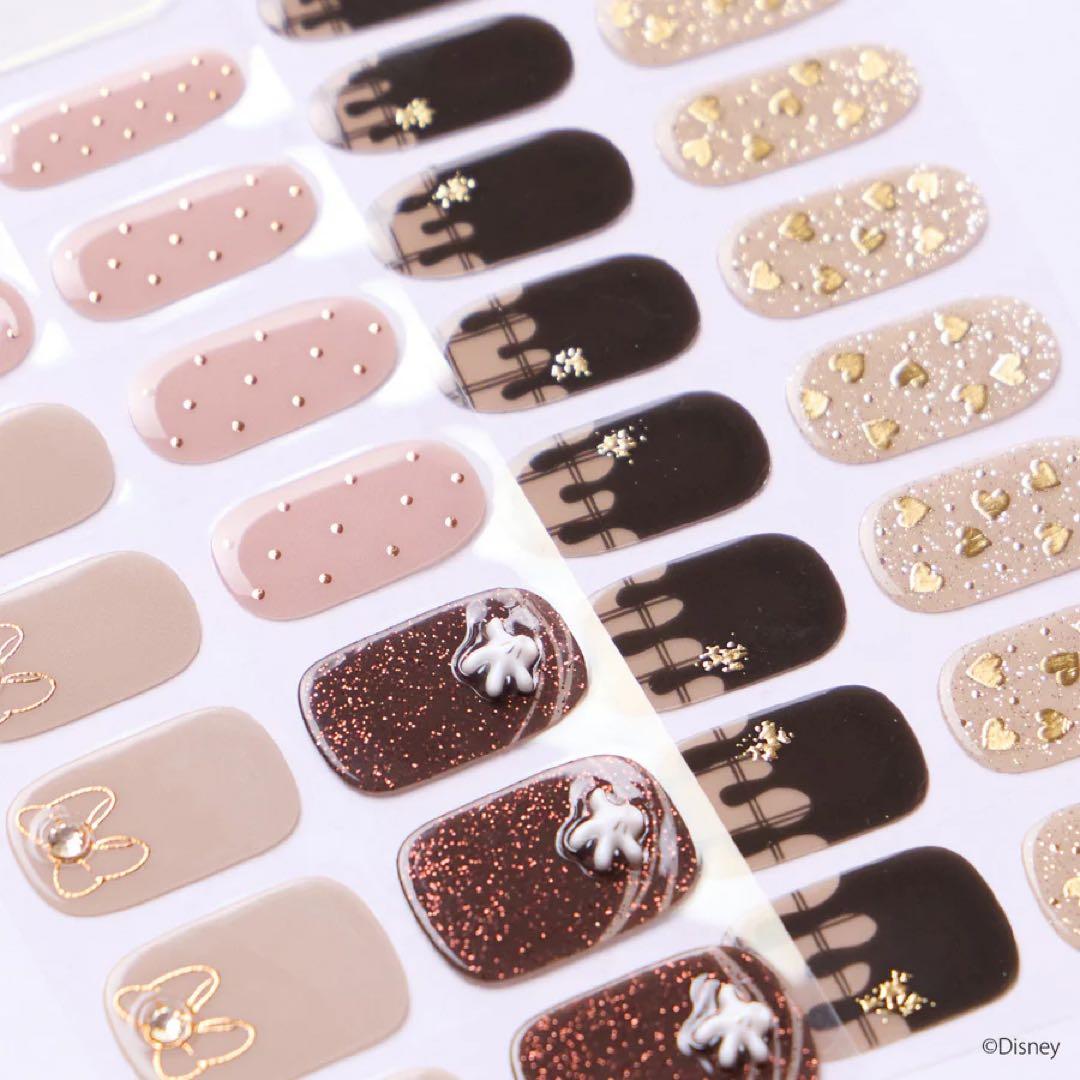 Sheets of ohora Disney Mickey and Minnie Valentine nail sticker designs in various sizes and patterns.