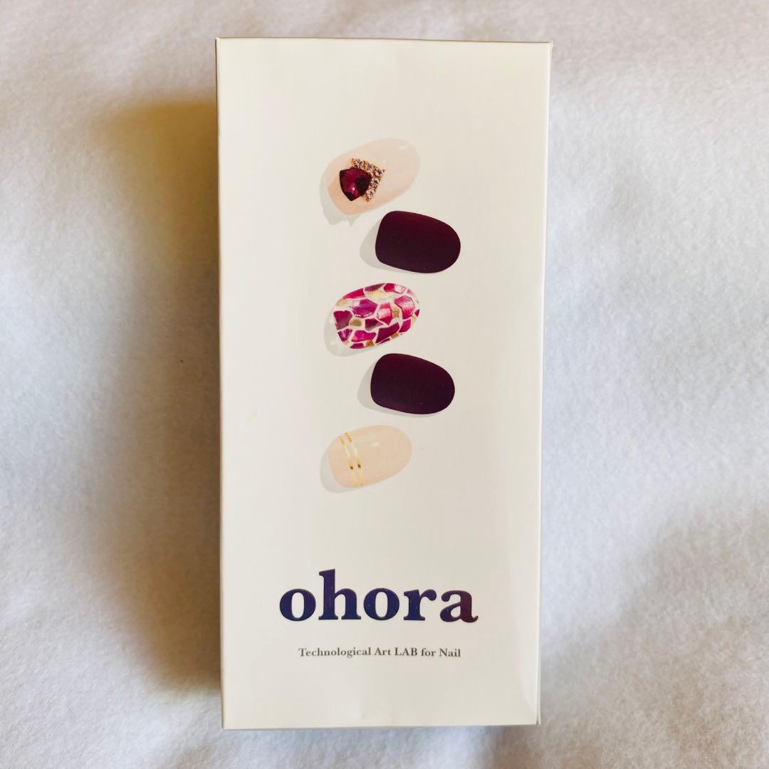 Photo of the ohora nail sticker product box showing five example nail designs on the front.