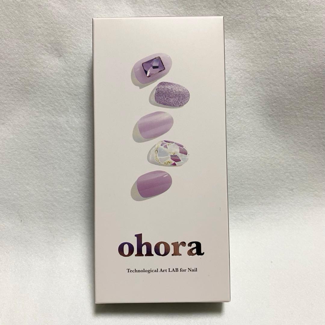 Box of ohora nail stickers showing five lavender nail designs and the ohora logo.