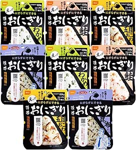 Front view of multiple packaged Oishi Shokuhin Alpha Rice portable onigiri pouches in assorted varieties arranged in rows.