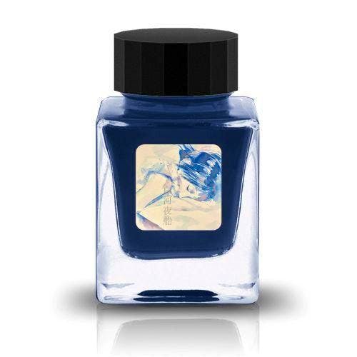 Close-up photo of the fountain pen ink bottle オカモトヤオリジナル 白河夜船 showing a square glass bottle filled with dark blue ink and a label.