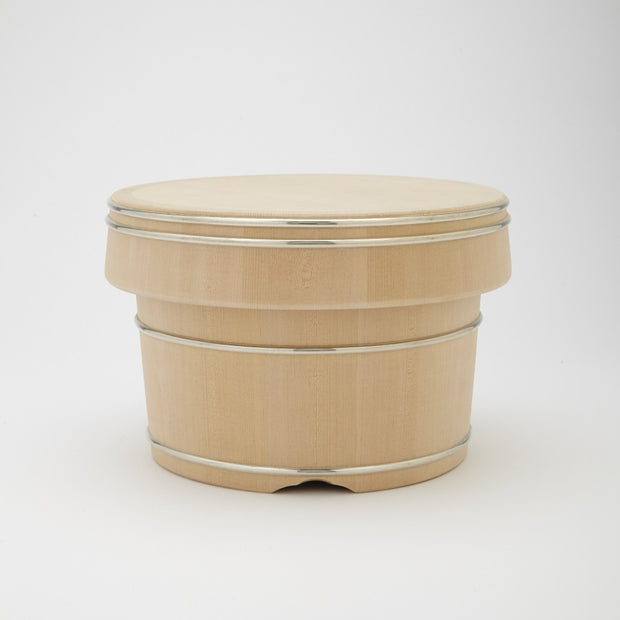 Front view of the bamboo bowl with lid and metal bands on white background.