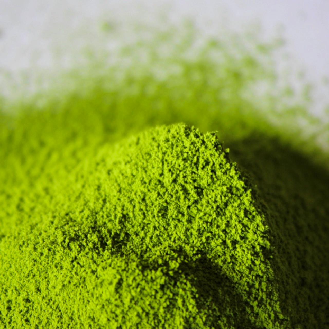 Close-up photo of a mound of bright green matcha green tea powder.
