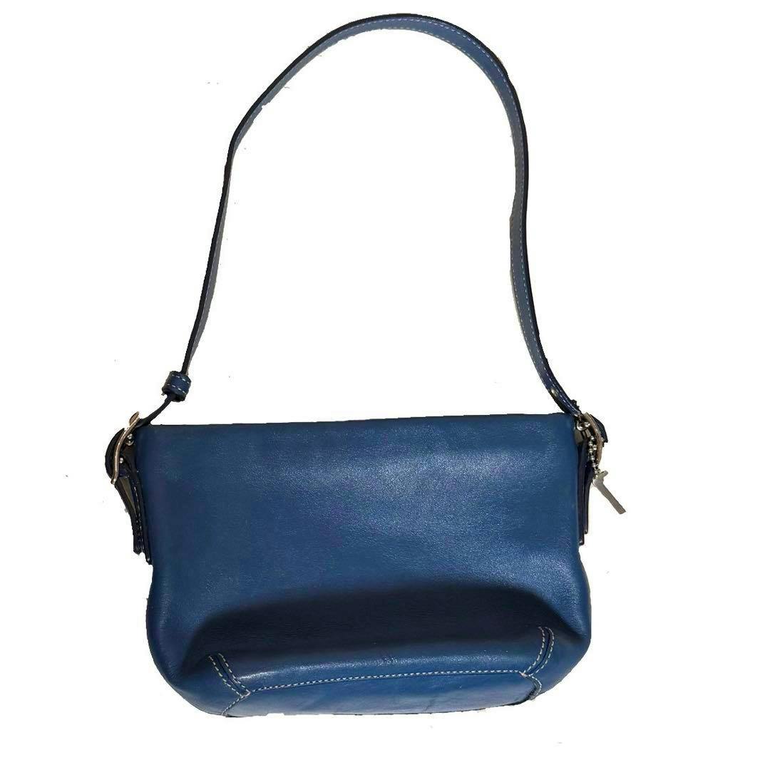Front view of a blue OLD COACH cow leather shoulder bag with a single strap on a white background.