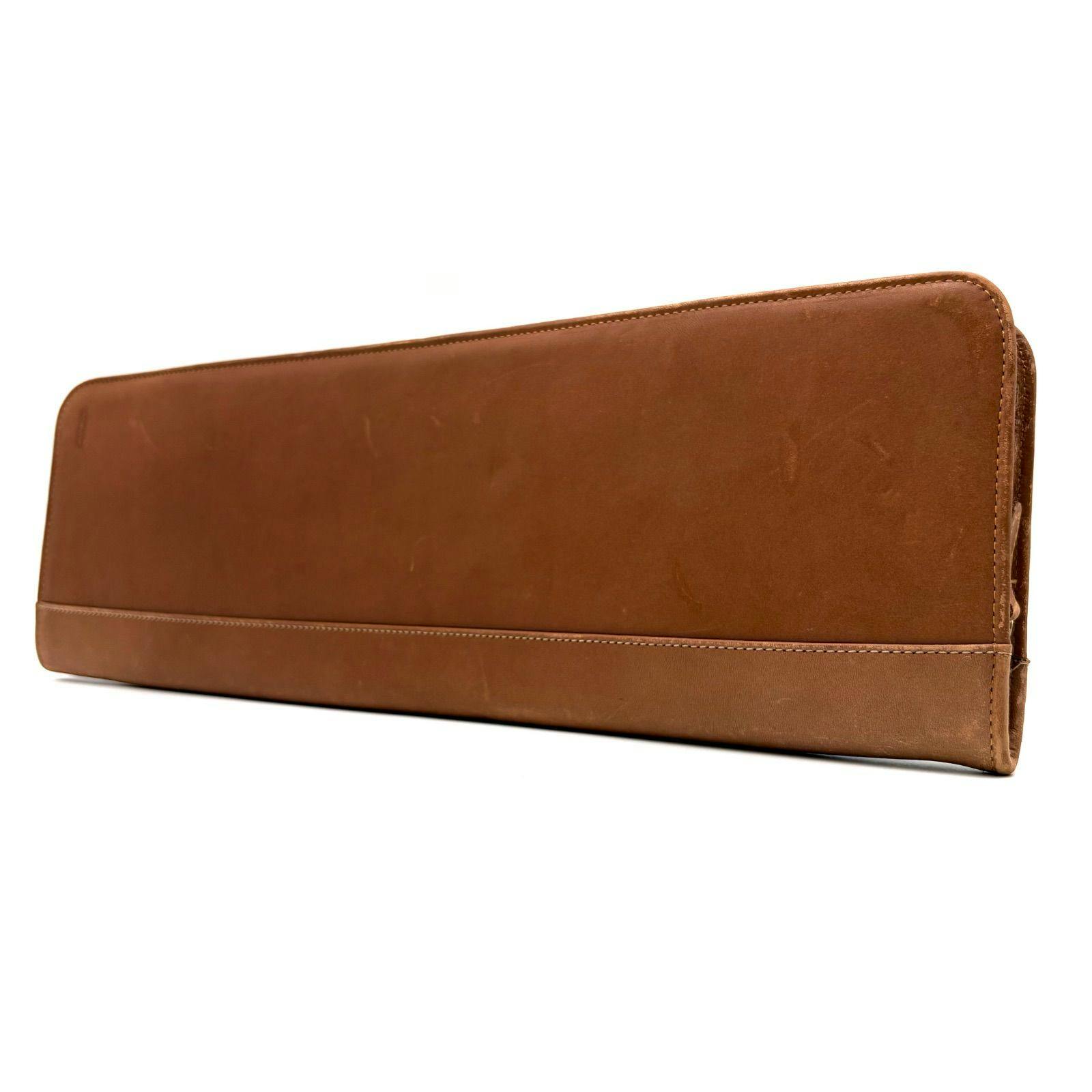 Brown leather tie case shown closed and photographed from the front.