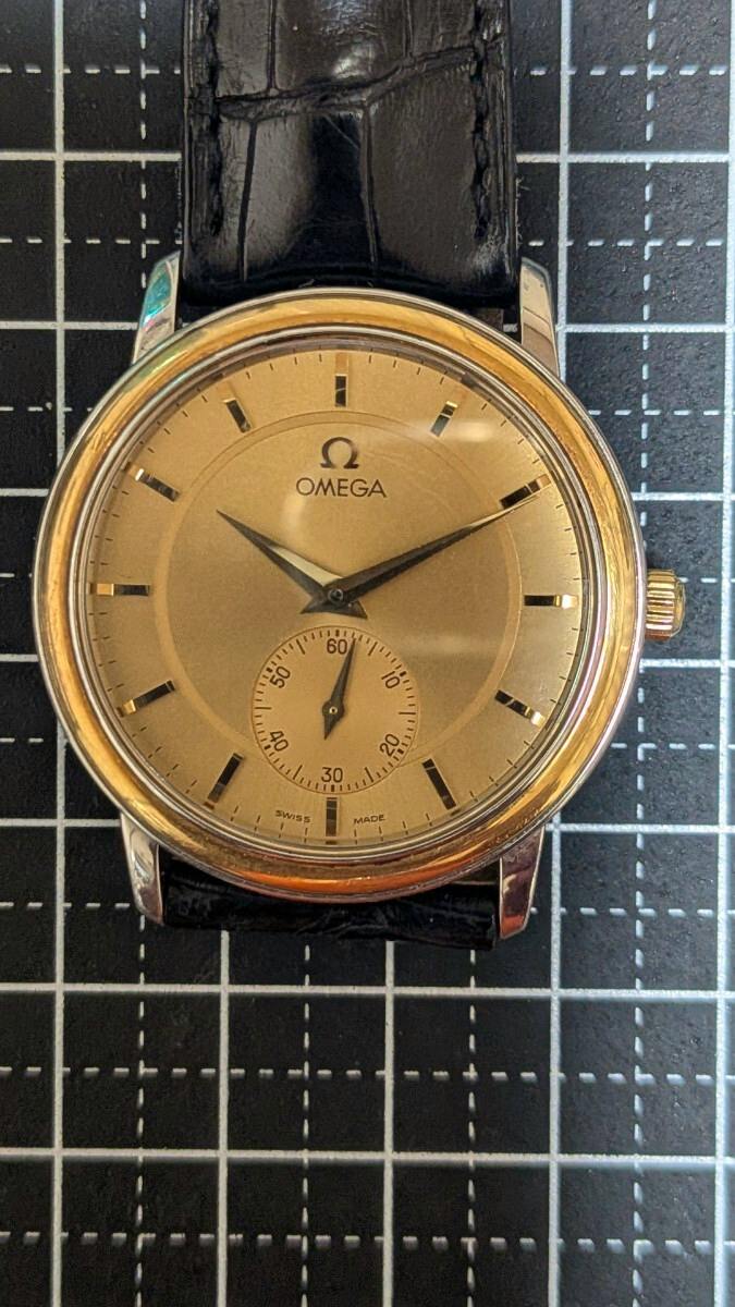 Front view of the Omega De Ville Prestige men's hand-wind vintage watch with a gold dial, small seconds at 6 o'clock, and black leather strap.