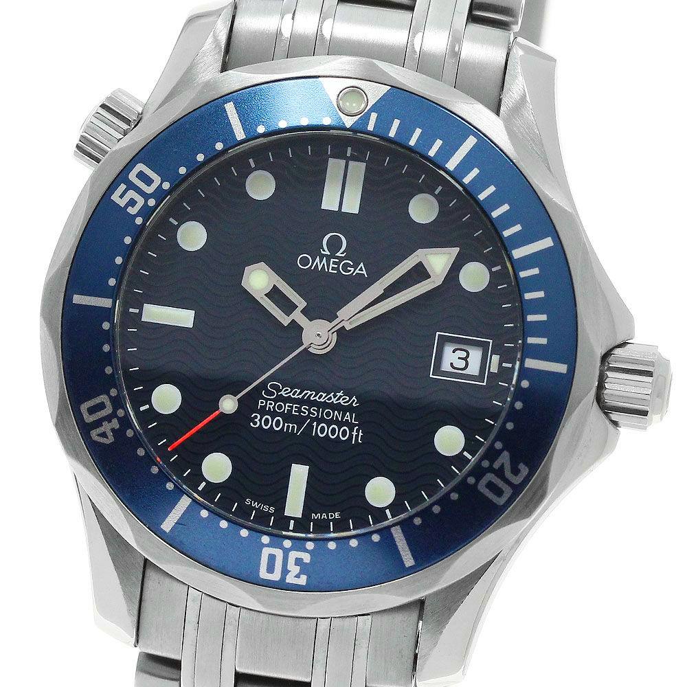 Close-up of an Omega Seamaster 300 watch with a blue bezel and wave-pattern dial, date at 3 o'clock, and stainless steel bracelet.