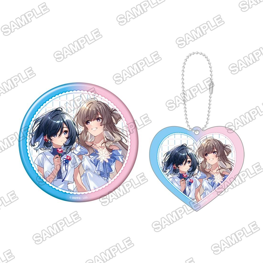 Round BIG can badge and heart-shaped acrylic keychain showing two illustrated girls in blue-and-white outfits.