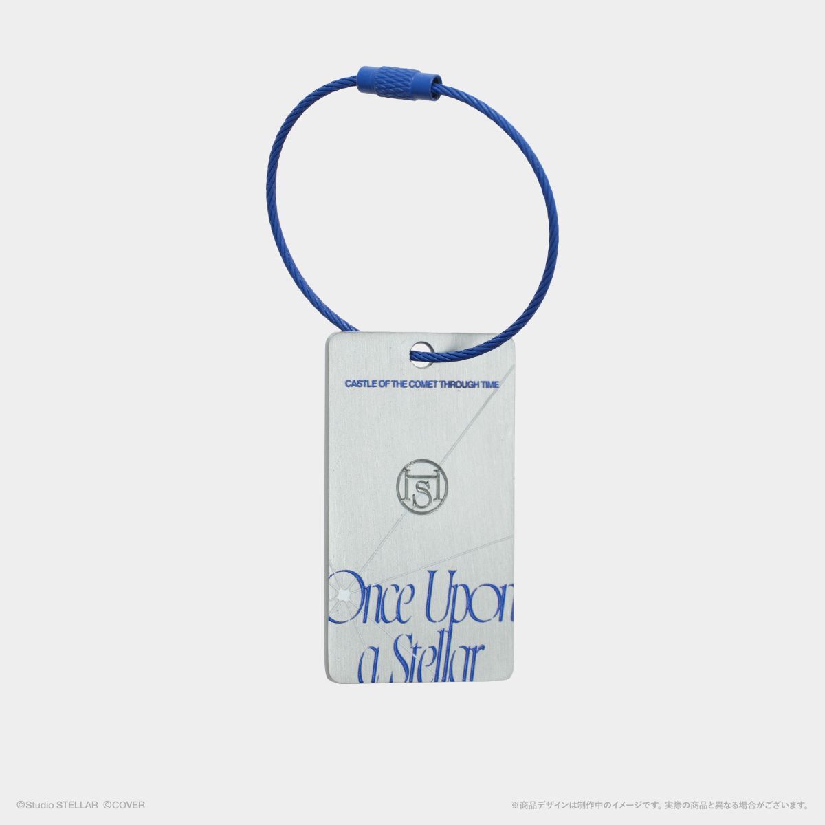 Rectangular metal keychain tag showing "Once Upon a Stellar" text with a blue cable loop attached.