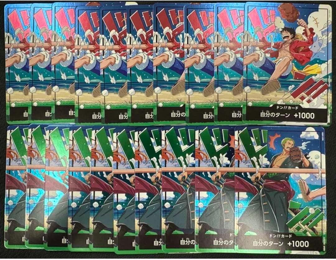 Twenty One Piece promo trading cards arranged in two rows (20 cards total) showing illustrated characters with green and blue holographic backgrounds.