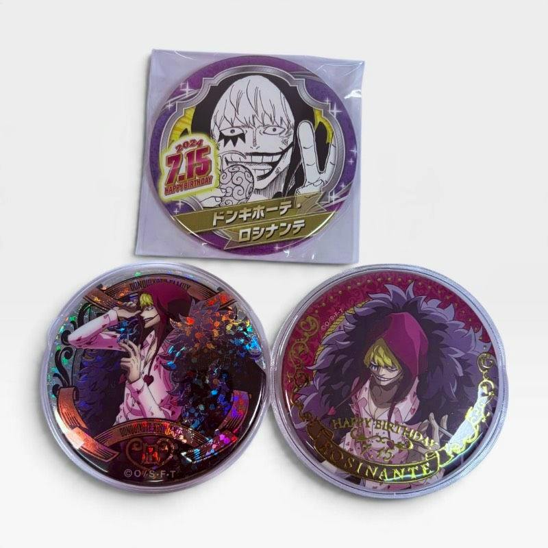 Three One Piece Corazon (Rosinante) can badges — two round holographic badges and one packaged badge — displayed on a white background.