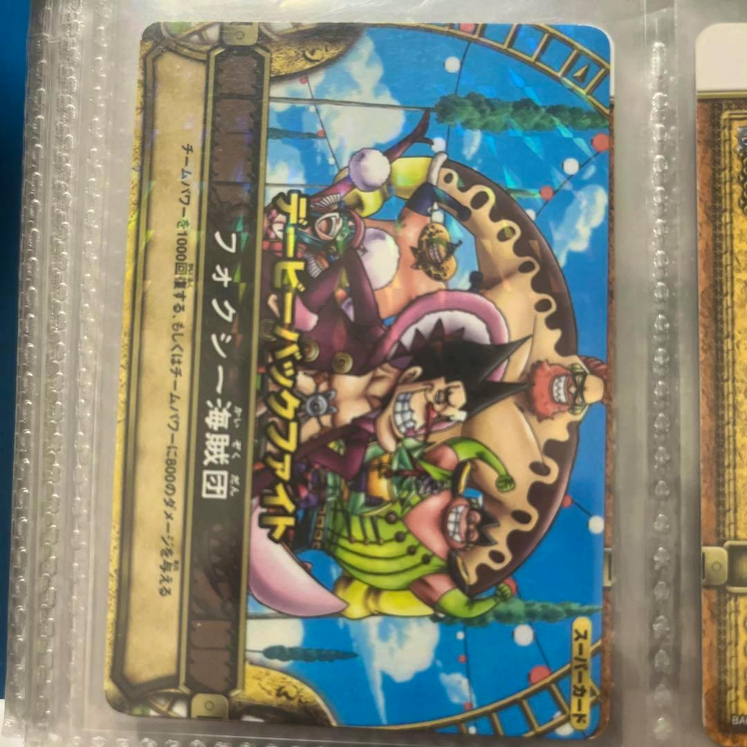 Photo of the 絶版 S030 デービーバックファイト フォクシー海賊団 R trading card in a plastic sleeve showing the card artwork and Japanese text.