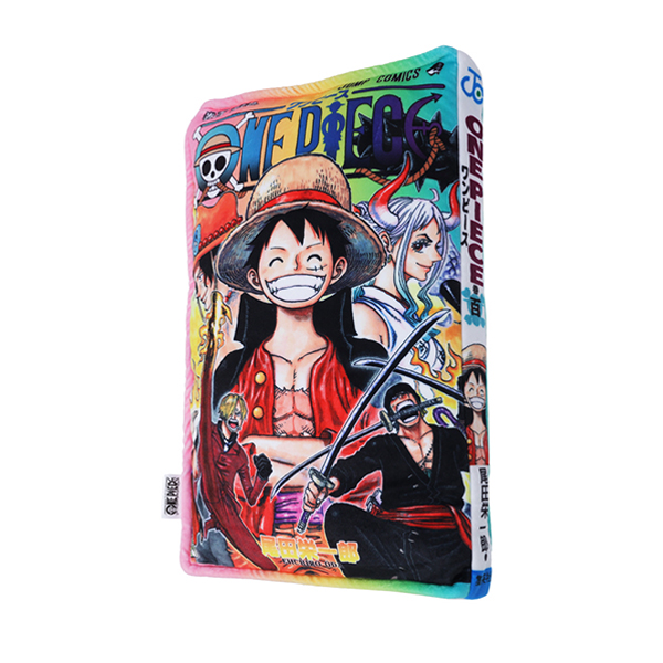 Angled view of a rectangular cushion printed like a ONE PIECE Jump Comics cover showing Luffy and other characters.