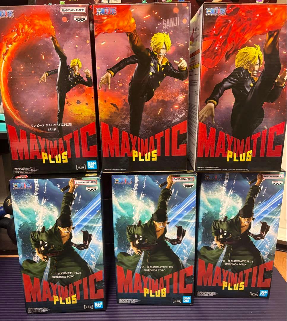 Six boxed One Piece MAXIMATIC figure packages displayed: three Sanji boxes on the top row and three Roronoa Zoro boxes on the bottom row.