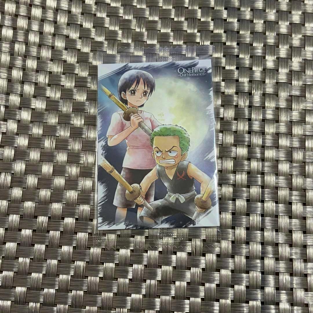 One Piece Our Memories photocard showing Zoro and Kuina placed on a woven surface.