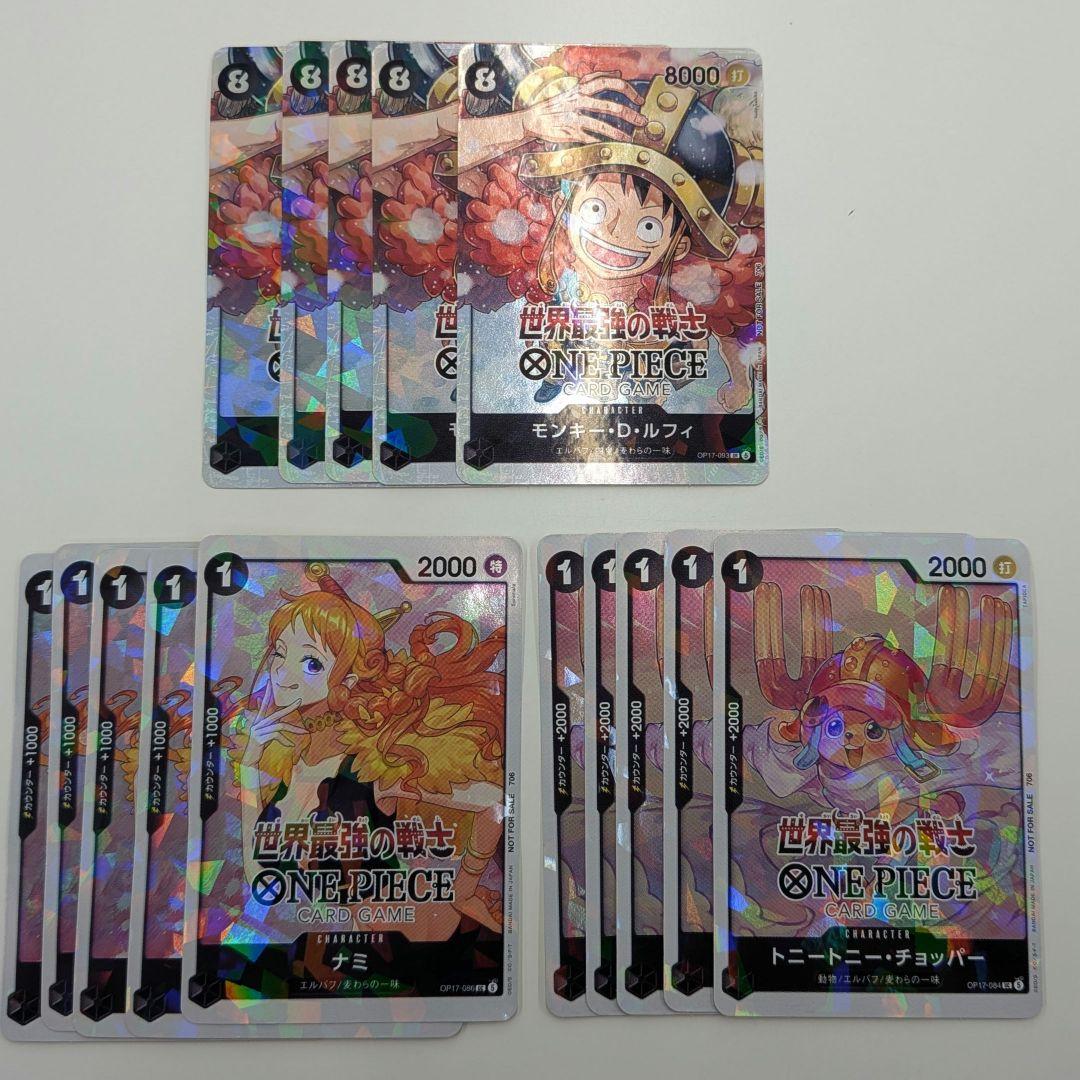 Photo of fifteen holographic One Piece character sticker cards featuring Luffy, Nami, and Chopper arranged in three groups.