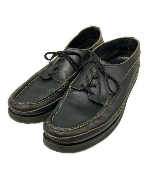 Pair of black leather moccasin-style deck shoes (Oneida double moccasin) on a white background.