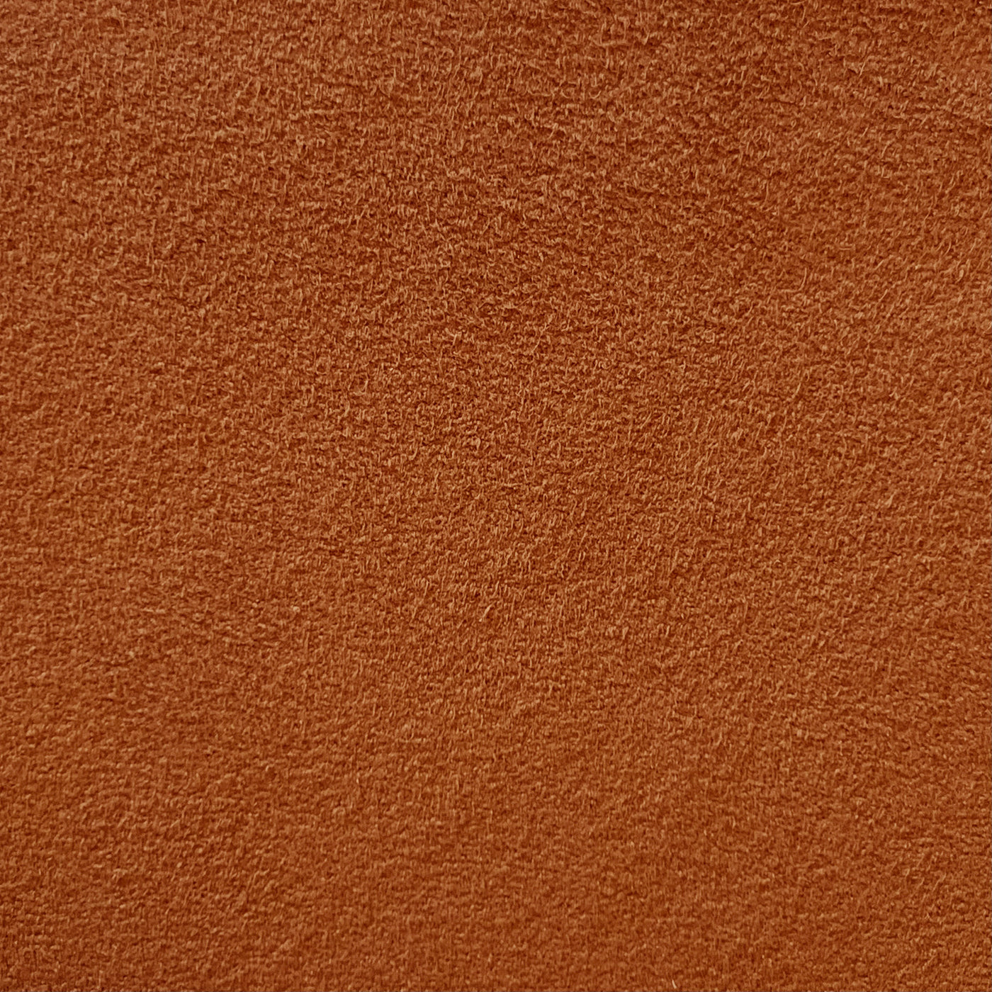 Close-up photograph of orange synthetic micro-suede fabric texture.