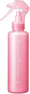 Pink spray bottle labeled "Treatment Hair Water" representing the Orbis hair treatment product.