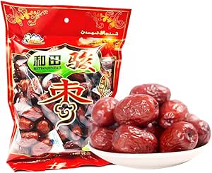 A sealed package of dried Japanese plums (jujubes) displayed next to a white bowl piled with the plums.