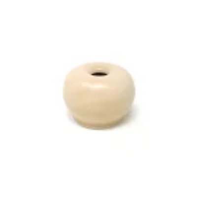Cream-colored ceramic tea-whisk stand (chasen tate) with a central hole on a white background.