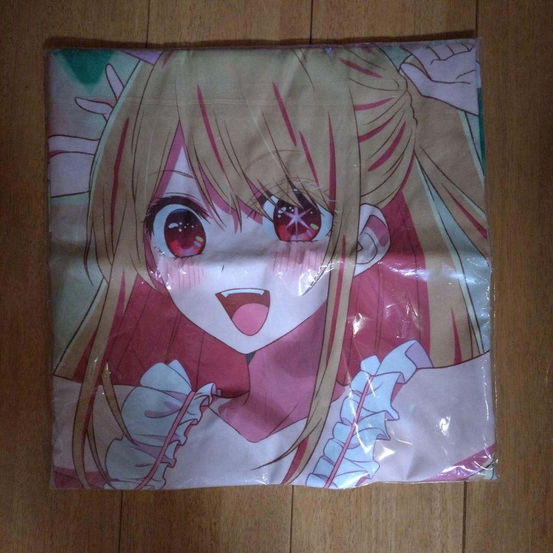 Folded '推しの子' premium multi-cloth (rayon) showing a smiling anime girl's face on a wooden floor.