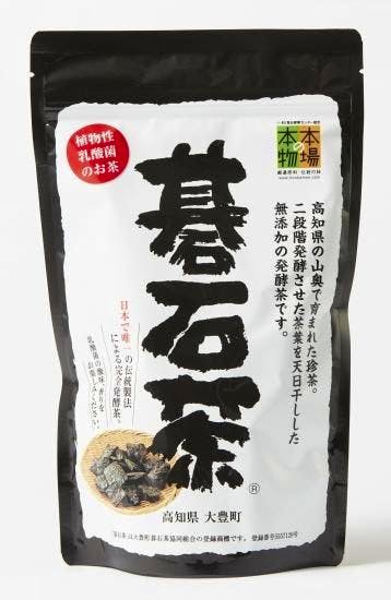 Front of a black-and-white resealable pouch of 大豊の碁石茶 (100g) showing Japanese text and a small photo of the loose tea.