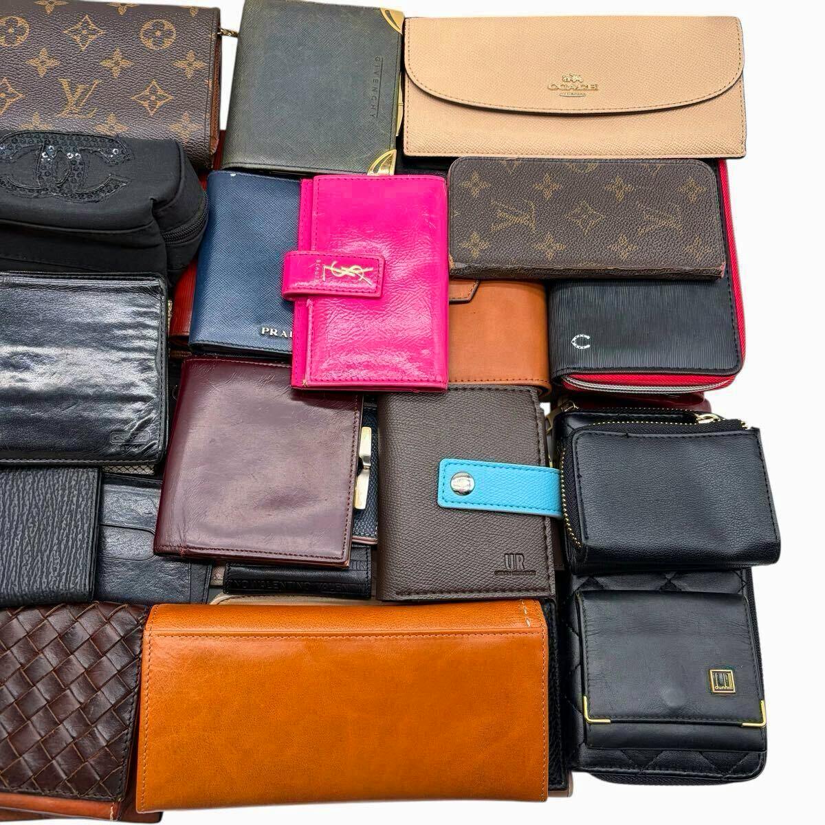 Top-down photo of an assortment of wallets and small leather goods arranged together on a white background.