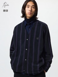 A model wearing the fleece oversized cardigan with vertical stripes and a button-up front.