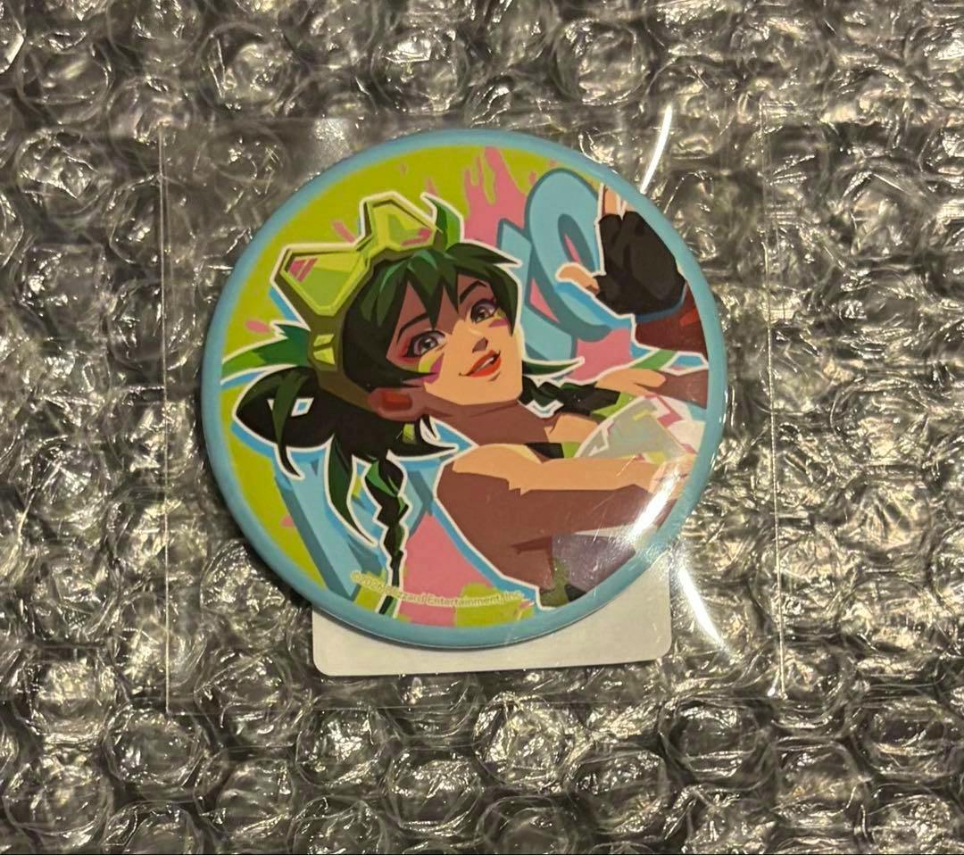 A round can badge featuring Overwatch character Kiriko illustrated in bright colors, placed on bubble wrap.