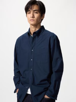 Male model wearing a navy oversized long-sleeve oxford shirt.