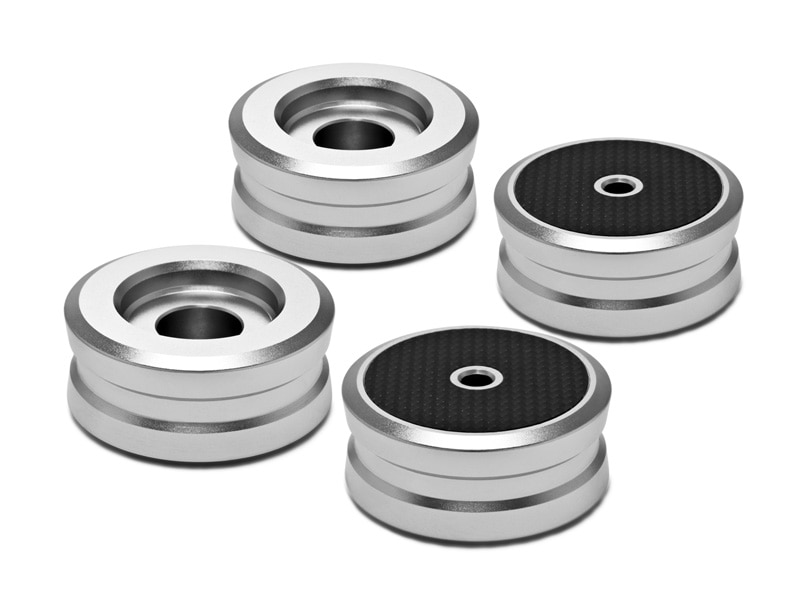Four silver OYAIDE INS-BS audio vibration isolation feet with black top pads displayed on a white background.